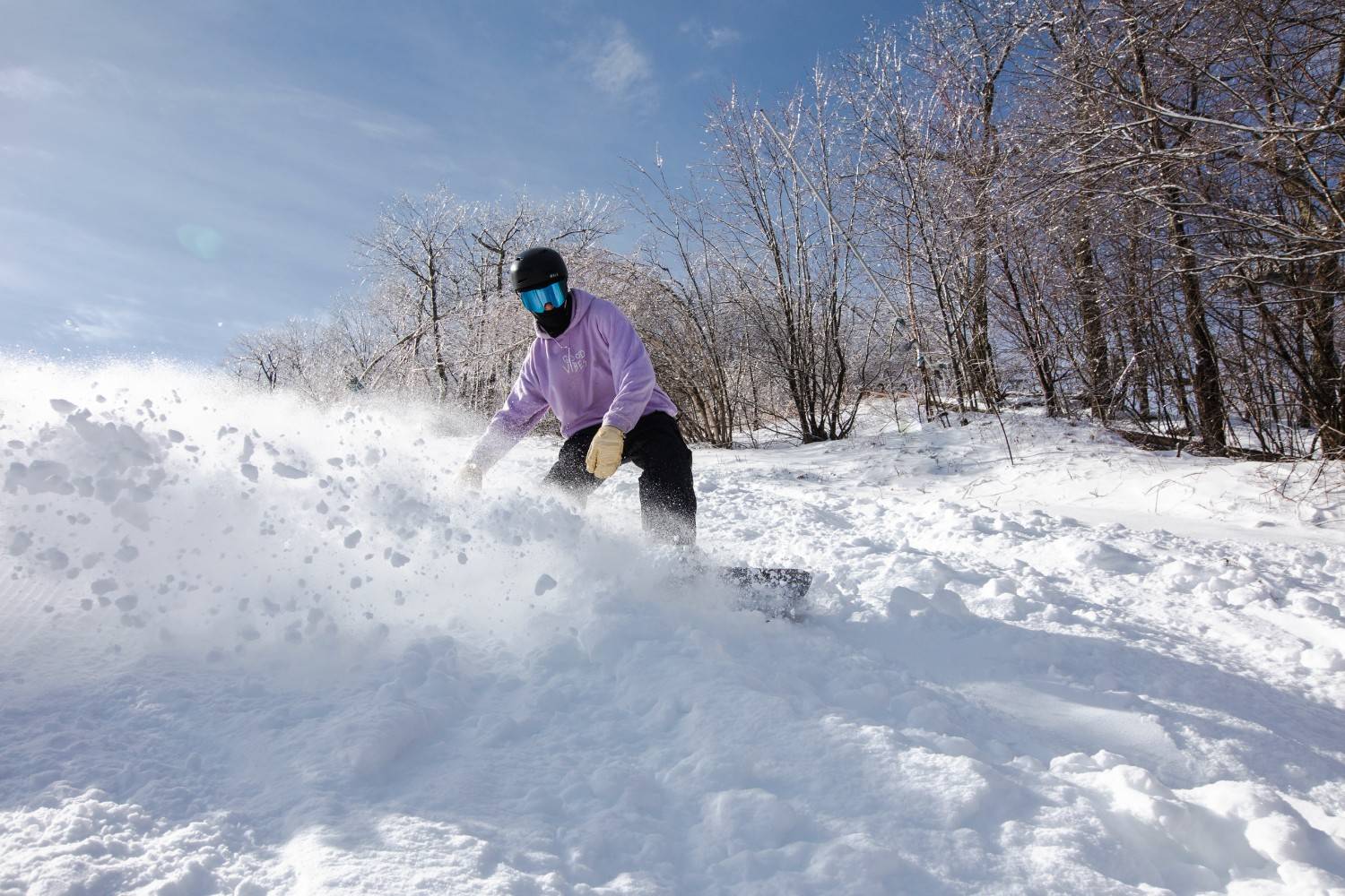 Man skiing down trail at Catamount