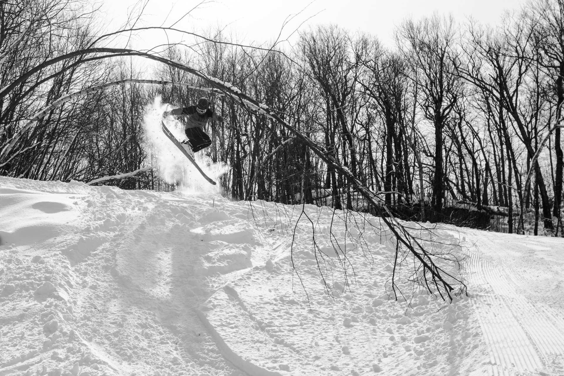 3 employees riding chairlift