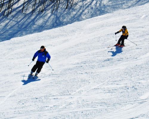 Ski instructor teaching a private lesson at Catamount Resort