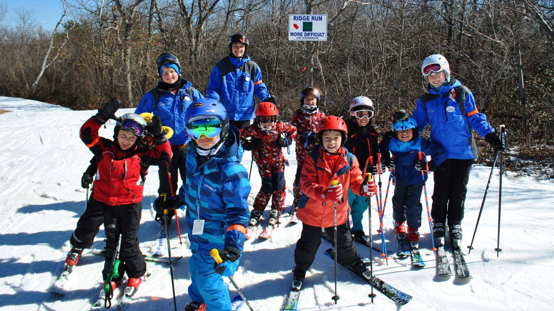 3 employees riding chairlift