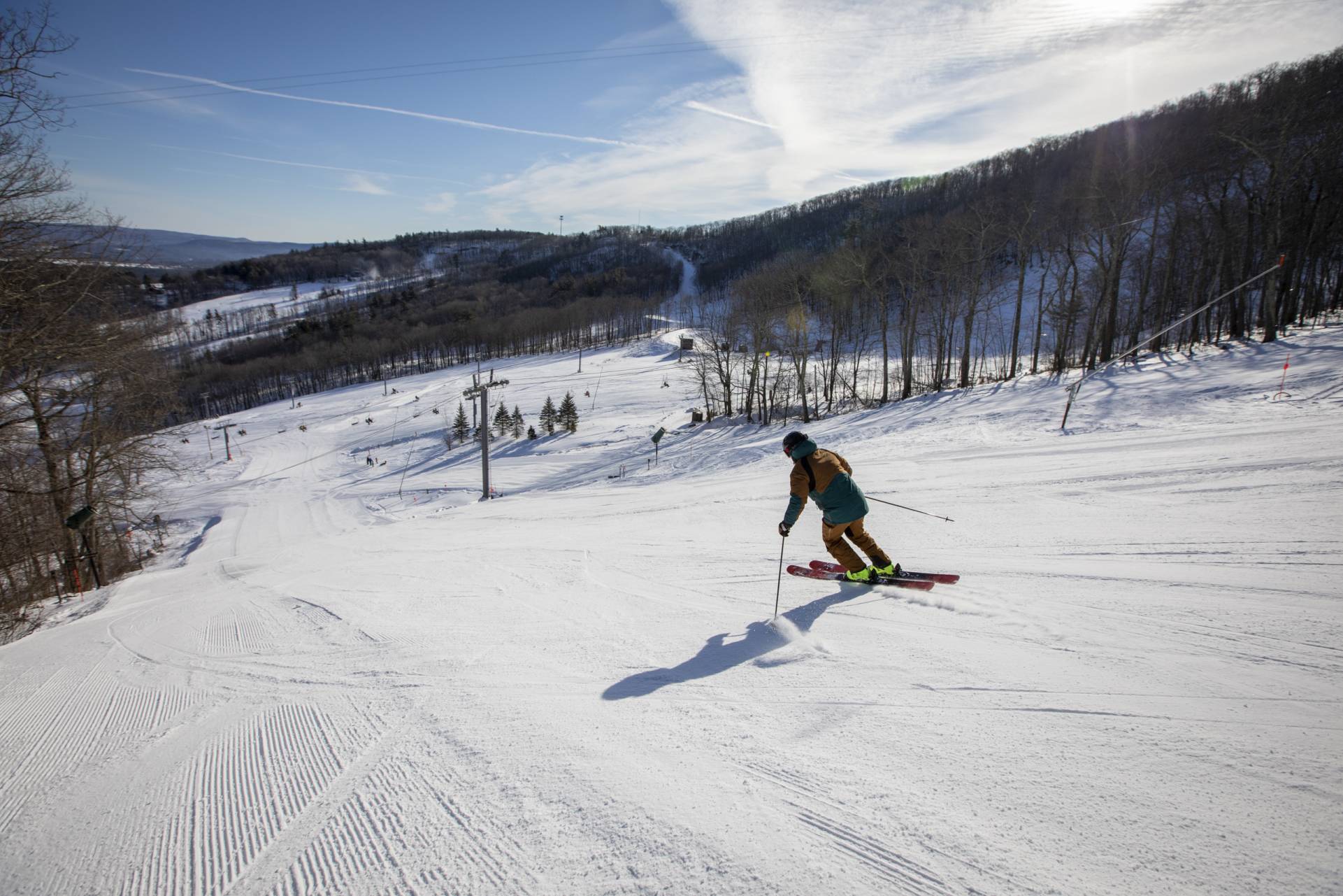 Man skiing down trail at Catamount