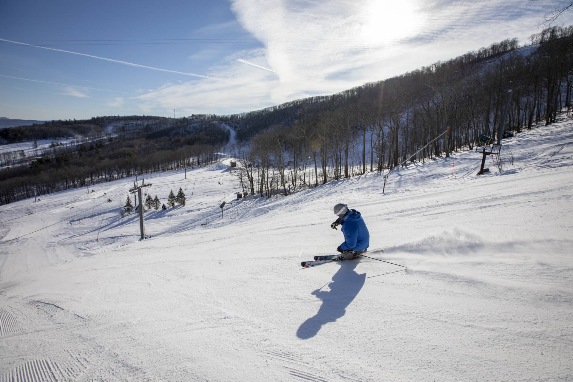 Man skiing down trail at Catamount