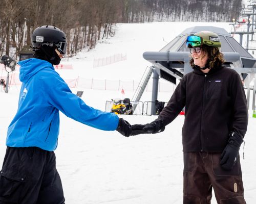Ski instructor teaching a private lesson at Catamount Resort